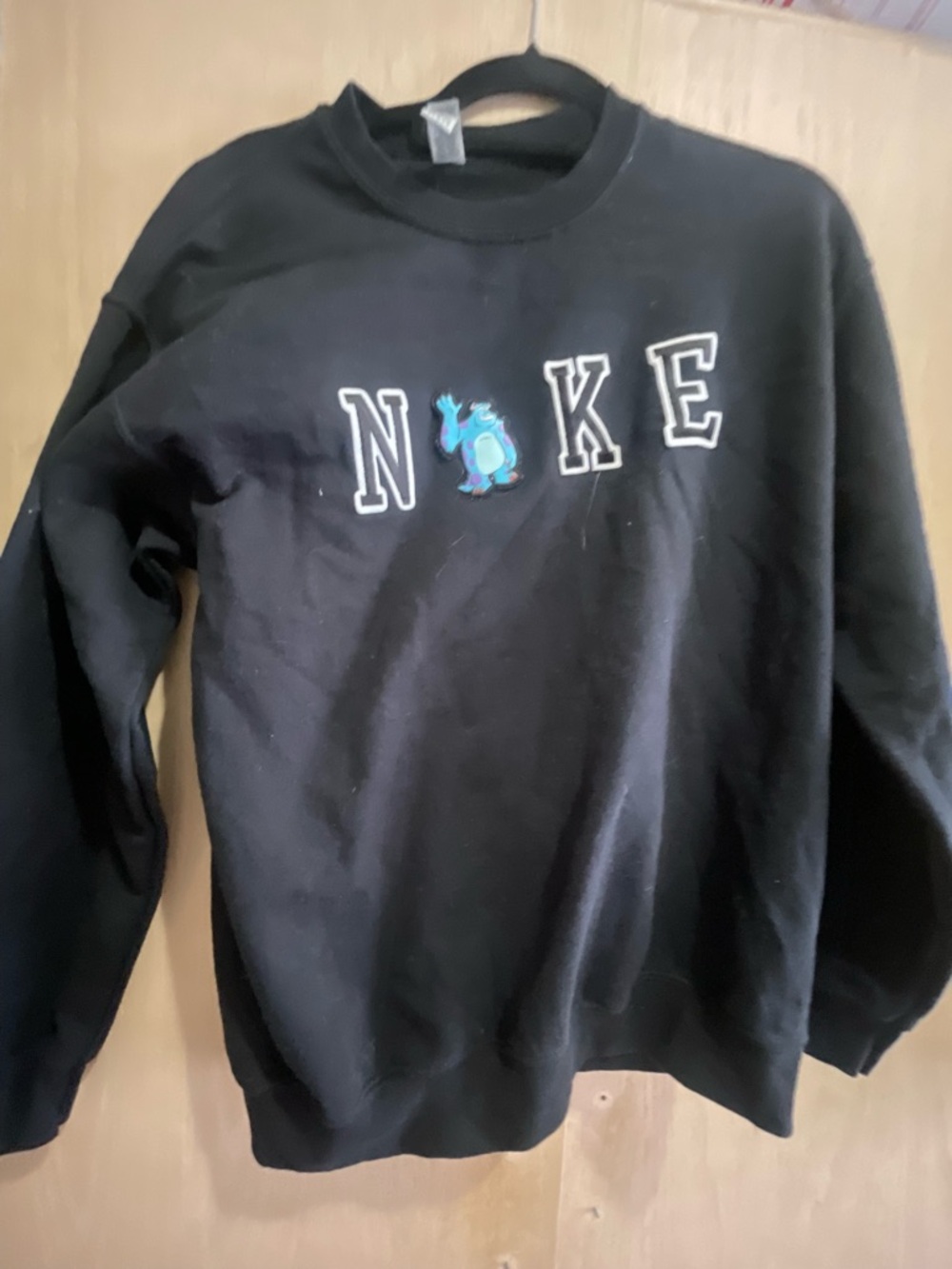 Gildan Black Crewneck Sweatshirt with Blue Character Detail